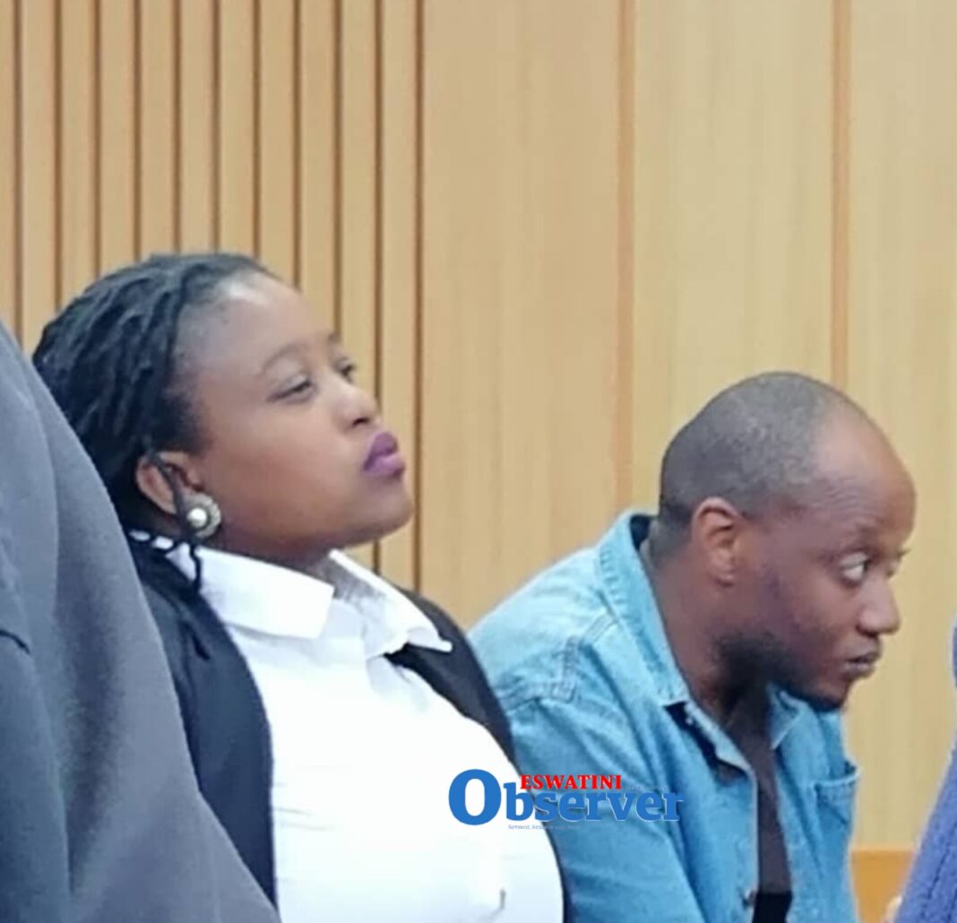 Sibulelo Jele who was accused of assaulting his girlfriend with his lawyer Nosisa Hlophe.