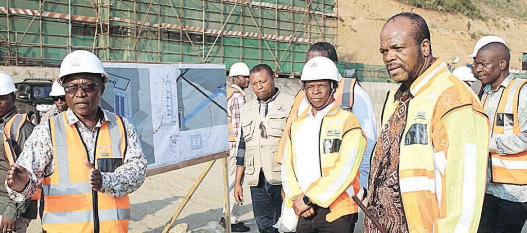Chief Resident Engineer Valey Vilane briefing the king during the tour while EWADE Chief Executive Officer Dr Samson Sithole listens.