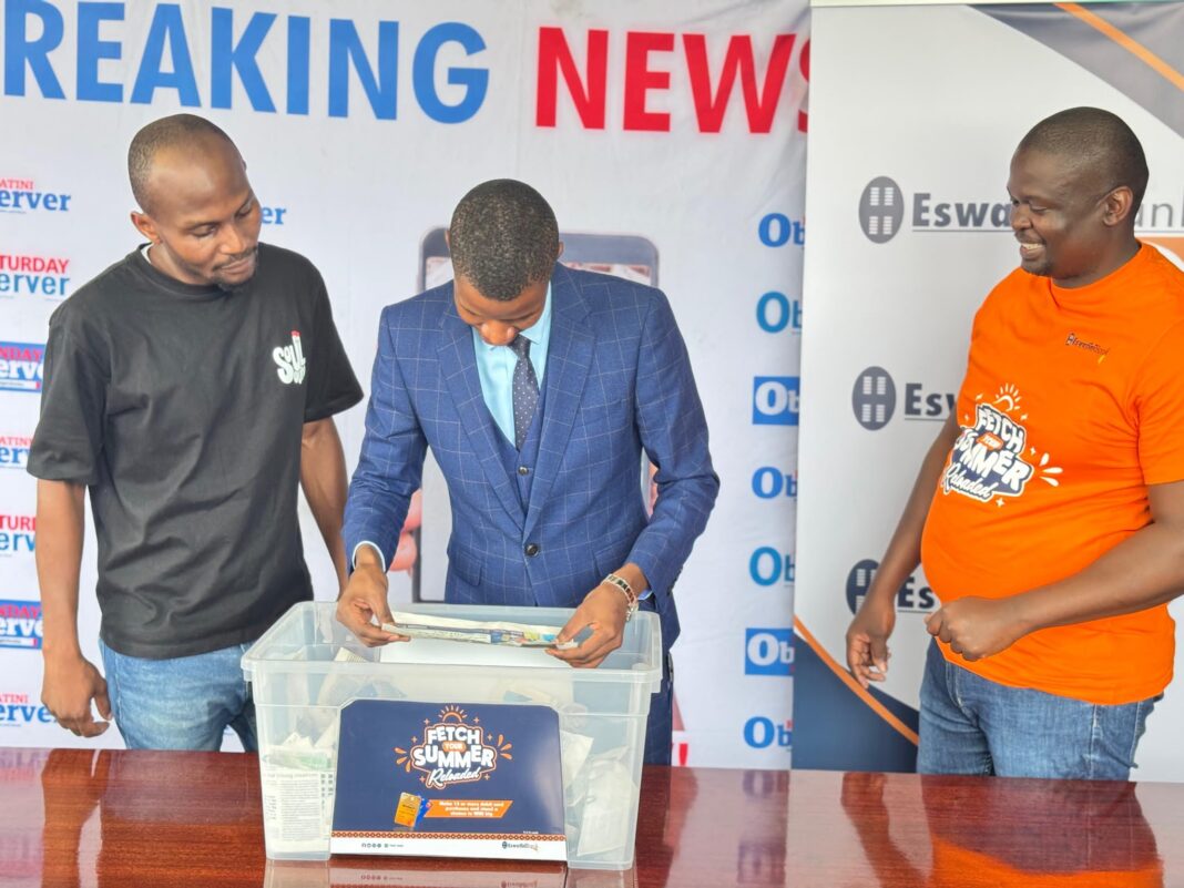 574069693_1353364090143813_2268457891859360051_n EswatiniBank Marketing team's Thembumenzi Mamba with Eswatini Observer's Melusi Magagula and Mduduzi Matsebula announcing the second winner of the draw.