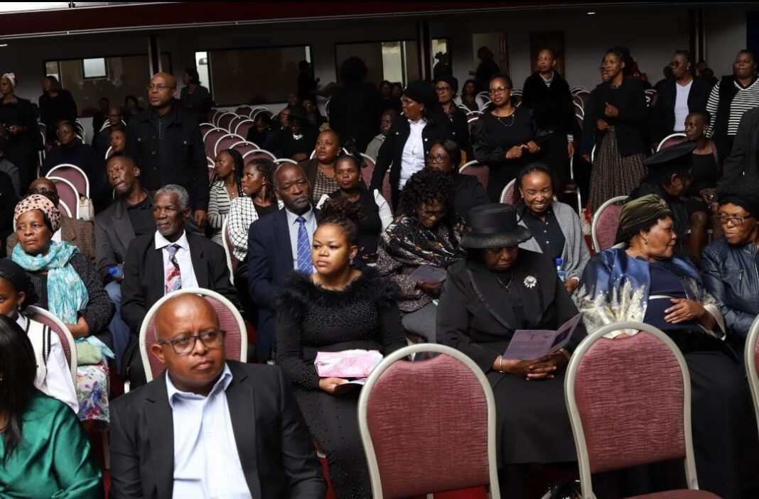 A section of the mourners at the memorial service. A section of the mourners at the memorial service.