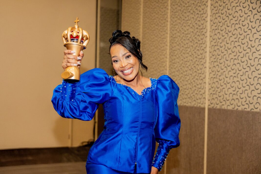 Hlophe showing of her award after the big win. Hlophe soaring with her voice, inspiring fans with every note.