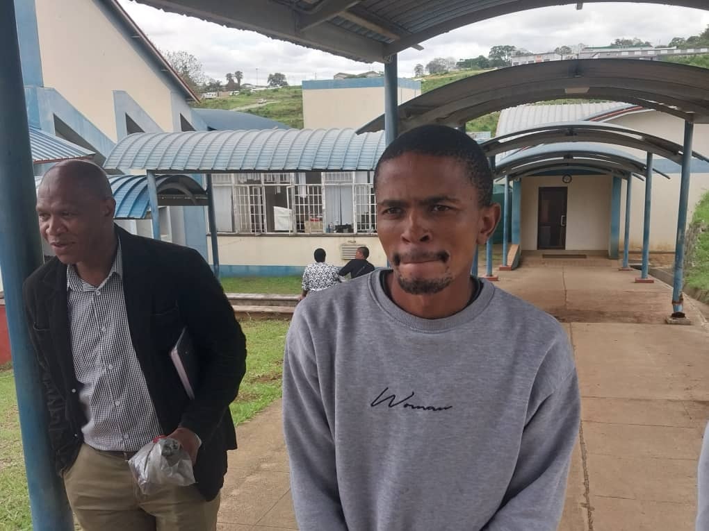 Sandile Matsenjwa being escorted by a plain-clothed police officer after his court appearance at the Manzini Magistrates Court (Pics; Kwanele Sibiya). Sandile Matsenjwa being escorted by a plain-clothed police officer after his court appearance at the Manzini Magistrates Court. (Pics: Kwanele Sibiya)
