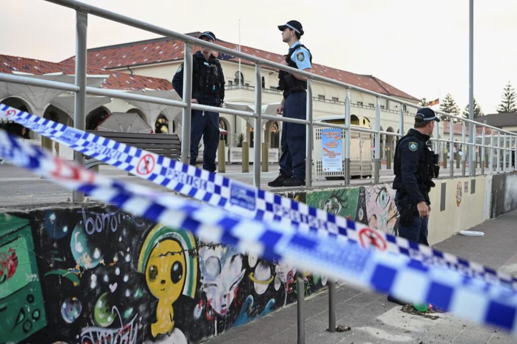 Police officers stand guard following the attack on a Jewish holiday celebration at Sydney's Bondi Beach, in Sydney, Australia, December 15, 2025.