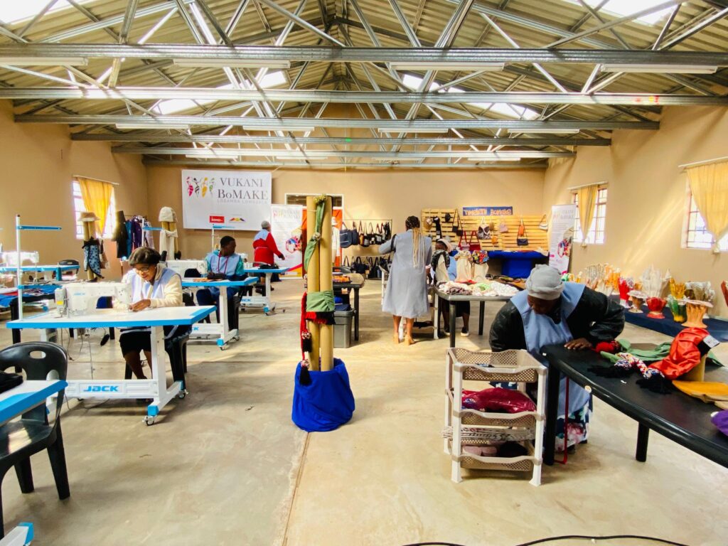Her factory employs 600 staff, 98% women, and her Vukani BoMake project empowers communities while reducing 50,000 kg of carbon emissions.