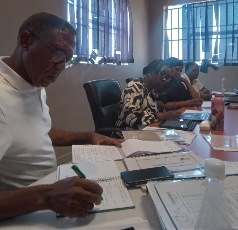 Gideon Mhlongo who is one of the commissioner's taking some notes Gideon Mhlongo who is one of the commissioners taking notes.