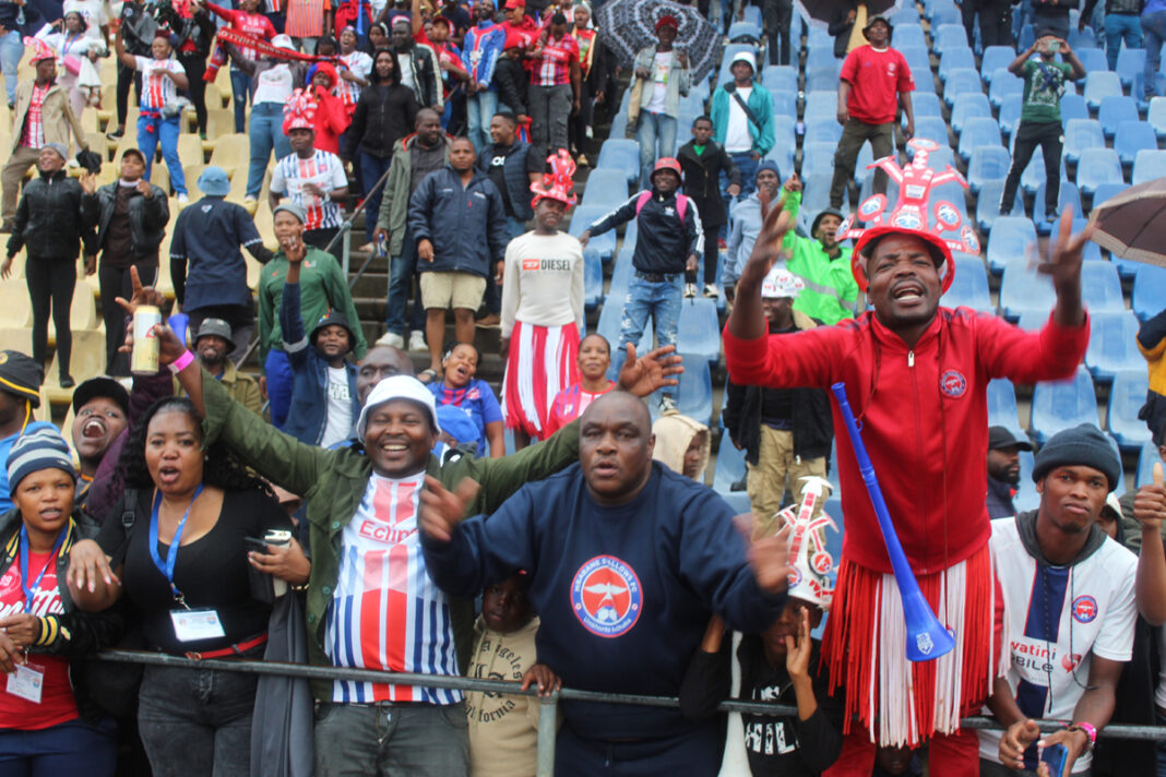Mbabane Swallows supporters celebrating their victory. Mbabane Swallows faces a critical turning point as legal experts and club factions call for urgent peace talks to end a leadership dispute and secure potential investors.