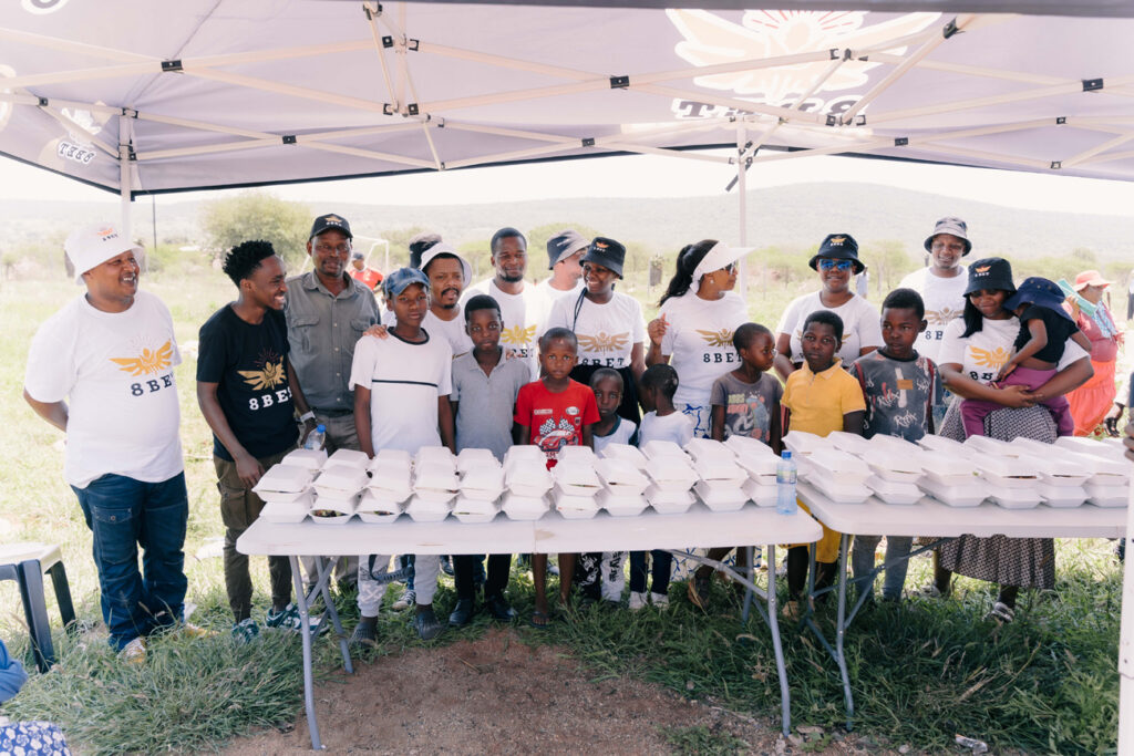 The 8bet team with some of the chidren who received a Christmas lunch.