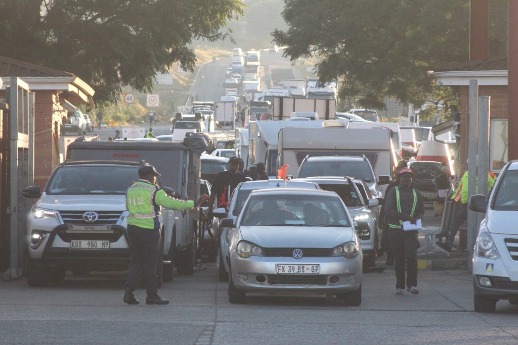 Thousands of festivalgoers flood into Eswatini through the Ngwenya Border ahead of the MTN Bushfire Festival, causing long queues and high excitement.