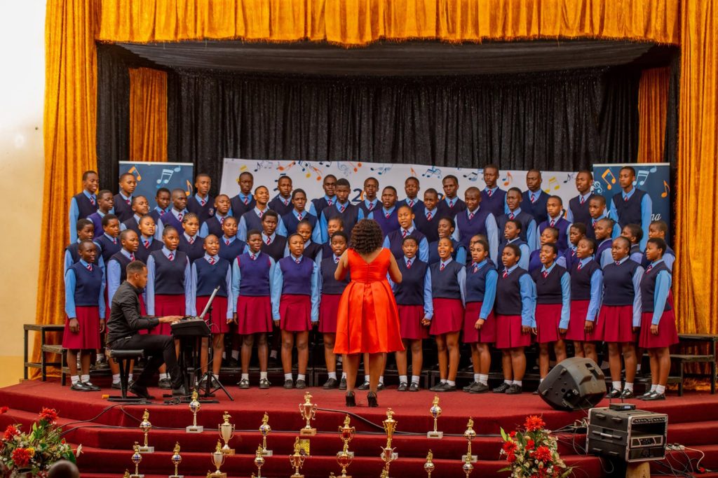 A school choir performs at a previous Eswatini Schools Choral Music Competition, showcasing precision, harmony and vibrant youth talent on stage.