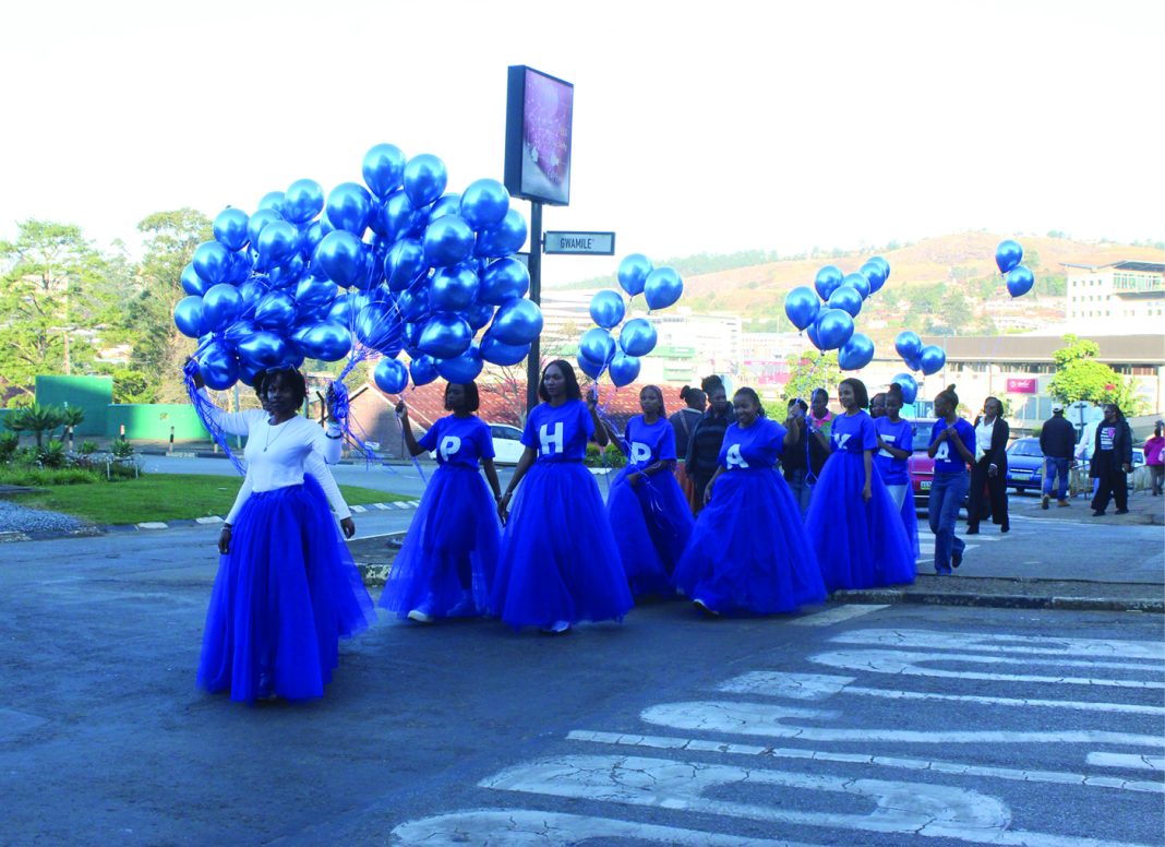 The agents walk past the SuperSpar on their way to the Mbabane Bus Rank. (Pics: Mduduzi Mngometulu)