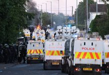 Northern Ireland unrest sparks fear among Emaswati Police stand guard as protests take place near the Chimney Corner Hotel in Northern Ireland on June 10, 2026 (Photo by Charles McQuillan/Getty Images)