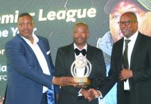 Qhogi questions awards process Nsingizini Hotspurs head coach Mandla Qhogi receiving his award from EFA’s Dr Comfort Shongwe and MTN Eswatini Head of Corporate Services Sibusiso Nhleko on Thursday evening.