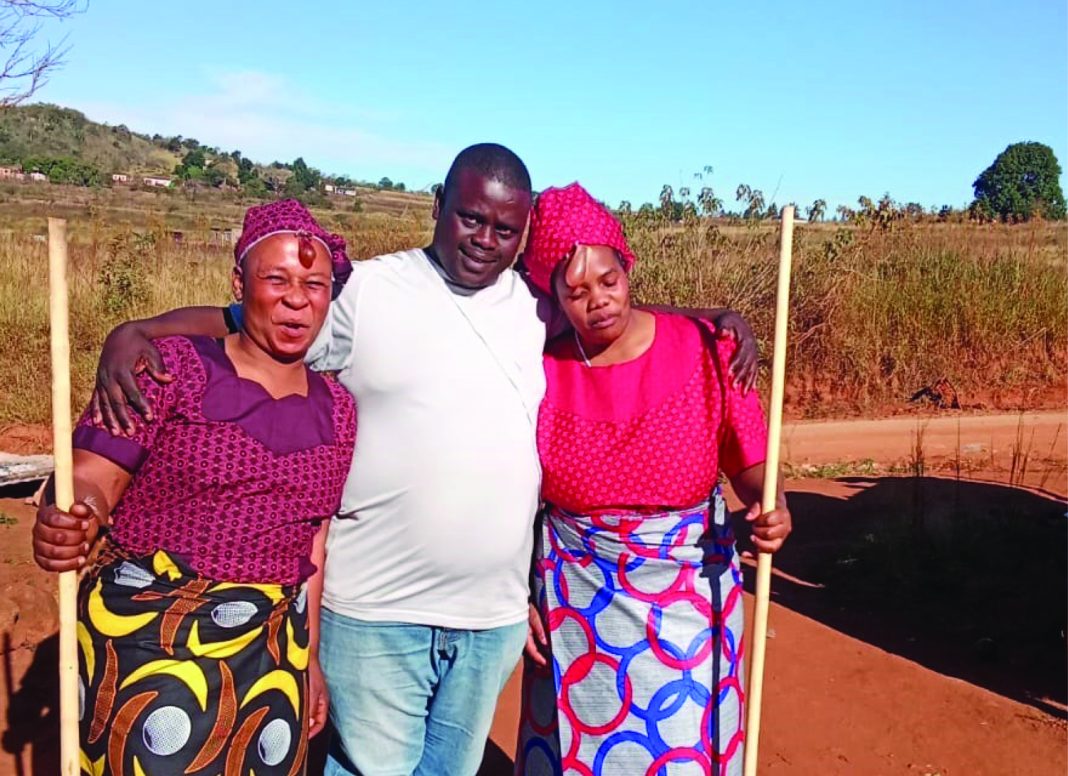 Wives Colani Simelane of Kumhlanga under Shiselweni II Inkhundla flanked by his two wives after the Kuteka ceremony.