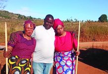 Nhlangano taxi driver marries 2 wives in 24hrs Colani Simelane of Kumhlanga under Shiselweni II Inkhundla flanked by his two wives after the Kuteka ceremony.
