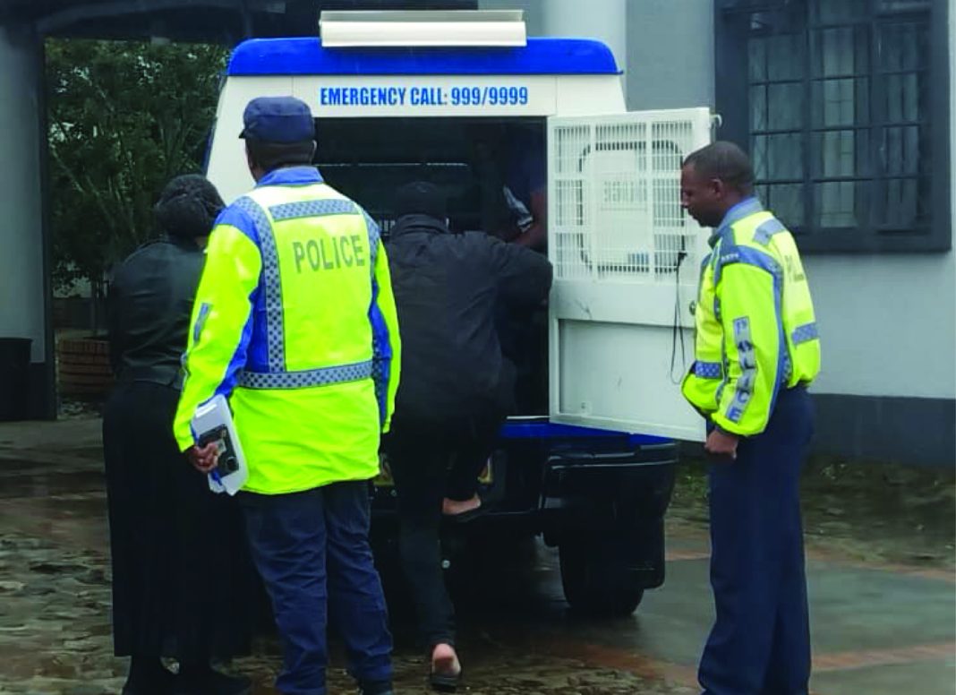 Arrested Drink-drivers boarding a police van.
