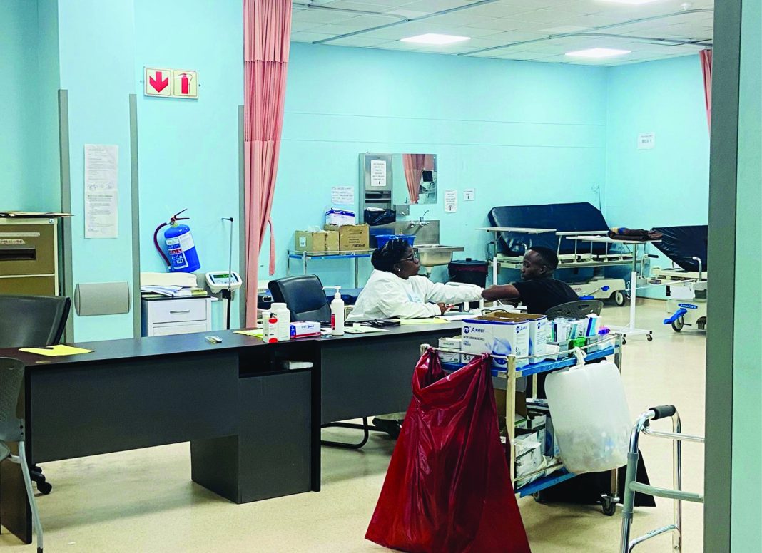 Govt A doctor at Mbabane Government Hospital assisting a patient yesterday.