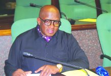 MPs seek review of embassy staffing, welfare MP Marwick Khumalo sorting his files before the start of the sitting. (Pics: Mduduzi Mngomezulu)