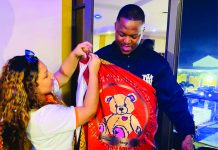 Carrot tickets honours Oscar Mbo with personalised gifts Carrot Tickets Public Relations Manager Natalie Smith presented Oscar Mbo with personalised umhelwane and ligcebesha.