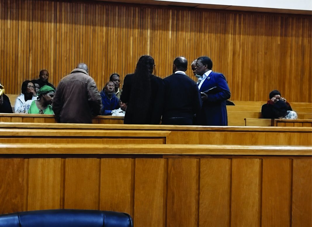 Status CApital Status Capital MD Michael Mbetse, Lawyer Banele Ngcamphalala taking instructions from the investors of Status Capital inside the courtroom.