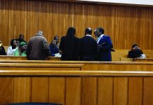 FSRA maintains Status Capital was a pyramid scheme Status Capital MD Michael Mbetse, Lawyer Banele Ngcamphalala taking instructions from the investors of Status Capital inside the courtroom.