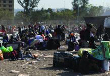 MARCH AND MARCH CRACKDOWN: SA landlords kick-out Emaswati tenants Foreign nationals sleep on the street in front of a home affairs office in Durban, South Africa.