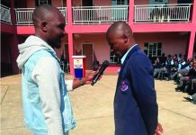 Ex-Vulamasango learner returns from Taiwan to inspire pupils Mzwandile Mtsetfwa interacting with a student at Vulamasango. (Courtesy Pic)
